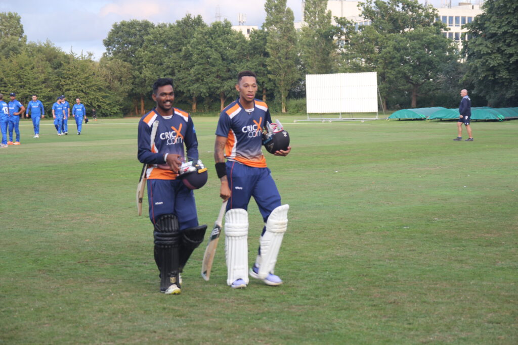 Raminda Wijesooriya and Thando Ntini walk off following a remarkable final ball chase.